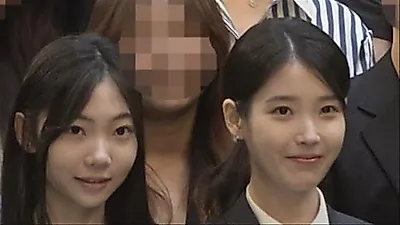 IU meets child actress Kim Tae-yeon from 'When Life Gives You Tangerines' at a wedding and performs celebratory song