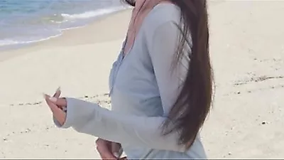 Lee Elijah radiates pure charm against blue ocean backdrop