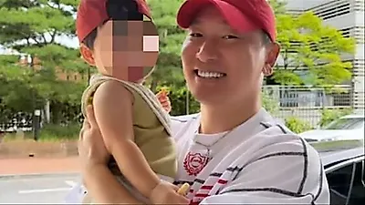 Rhymer shares heartwarming 'fatherly smile' while holding Han Dong-geun's son