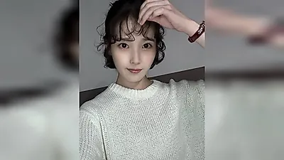 IU transforms with curly bob—looking just like a doll